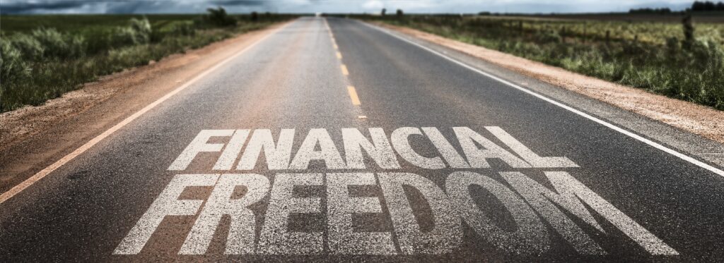Financial Freedom written on rural road