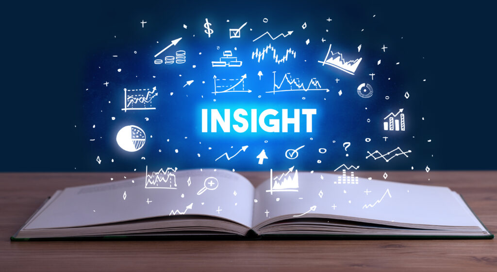 INSIGHT inscription coming out from an open book, business concept